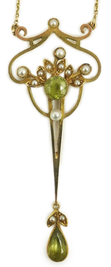 An early 20th century style gold, peridot and seed pearl set drop pendant, on an 18k gold chain